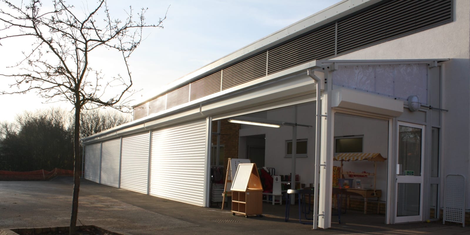 Enclosed canopy with roller shutters made for Laughton Manor School