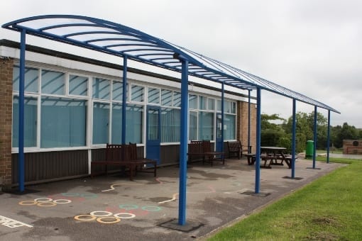 Curved roof shelter we installed at Old Dalby School
