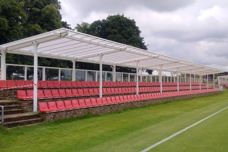 Straight roof shelter covering spectator stand at St George's Park