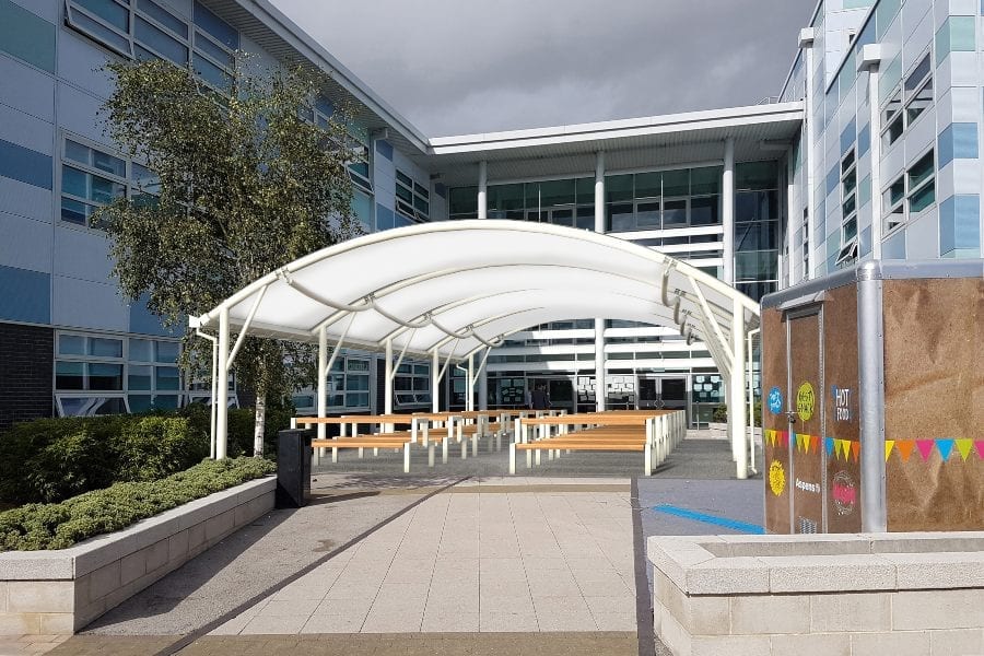White school shelter with fabric roof
