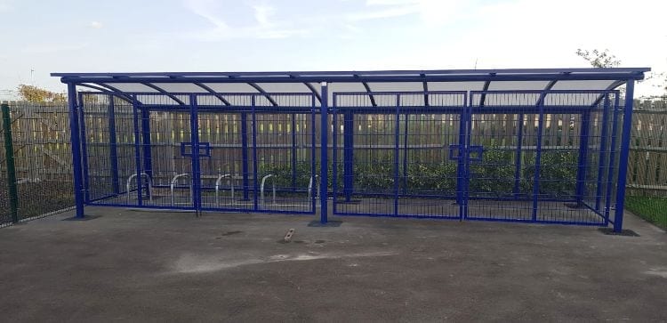 Blue cycle shelter we made for Riverside Bridge School