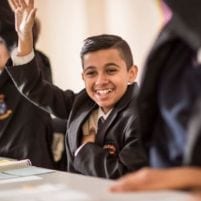 School Pupil with Hand Up