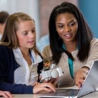 Teacher and student working together