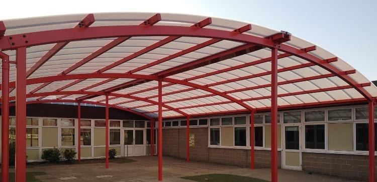 Red shelter we designed for Woodlands Primary School