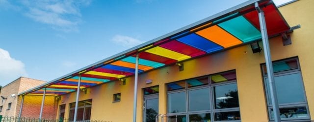 Multicoloured polycarbonate roof canopy at Ysgol Bro Teifi