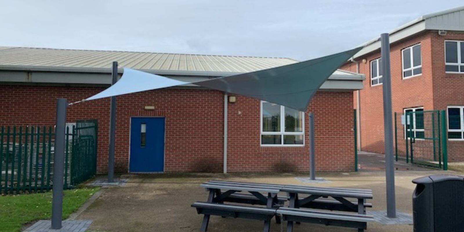 Blue shade sail we designed for St Mary's College