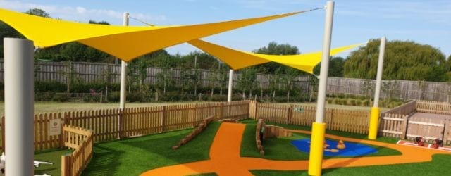 Yellow shade sails designed for Sprouts Play Barn