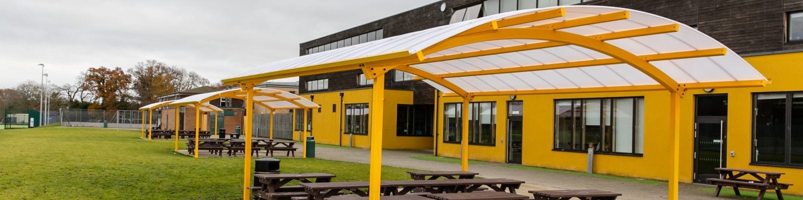 Curved roof shelters we fitted at Waingels College