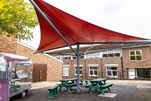 Red fabric shelter we manufactured for Hillview School for Girls