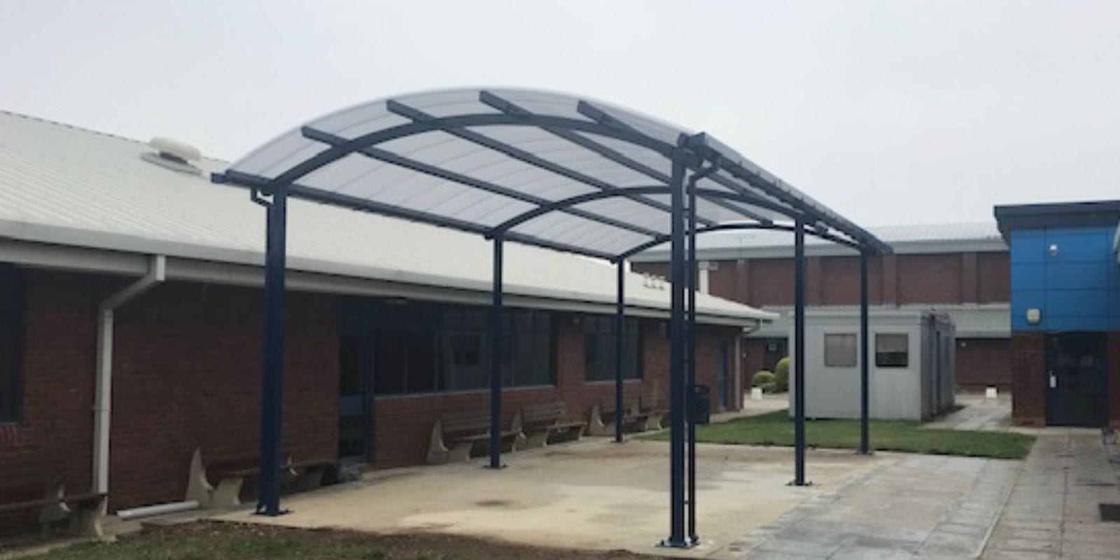 Curved roof shelter we designed for Sir Thomas Rich's School