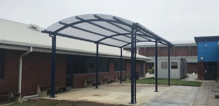 Curved roof canopy we installed at Sir Thomas Rich's School