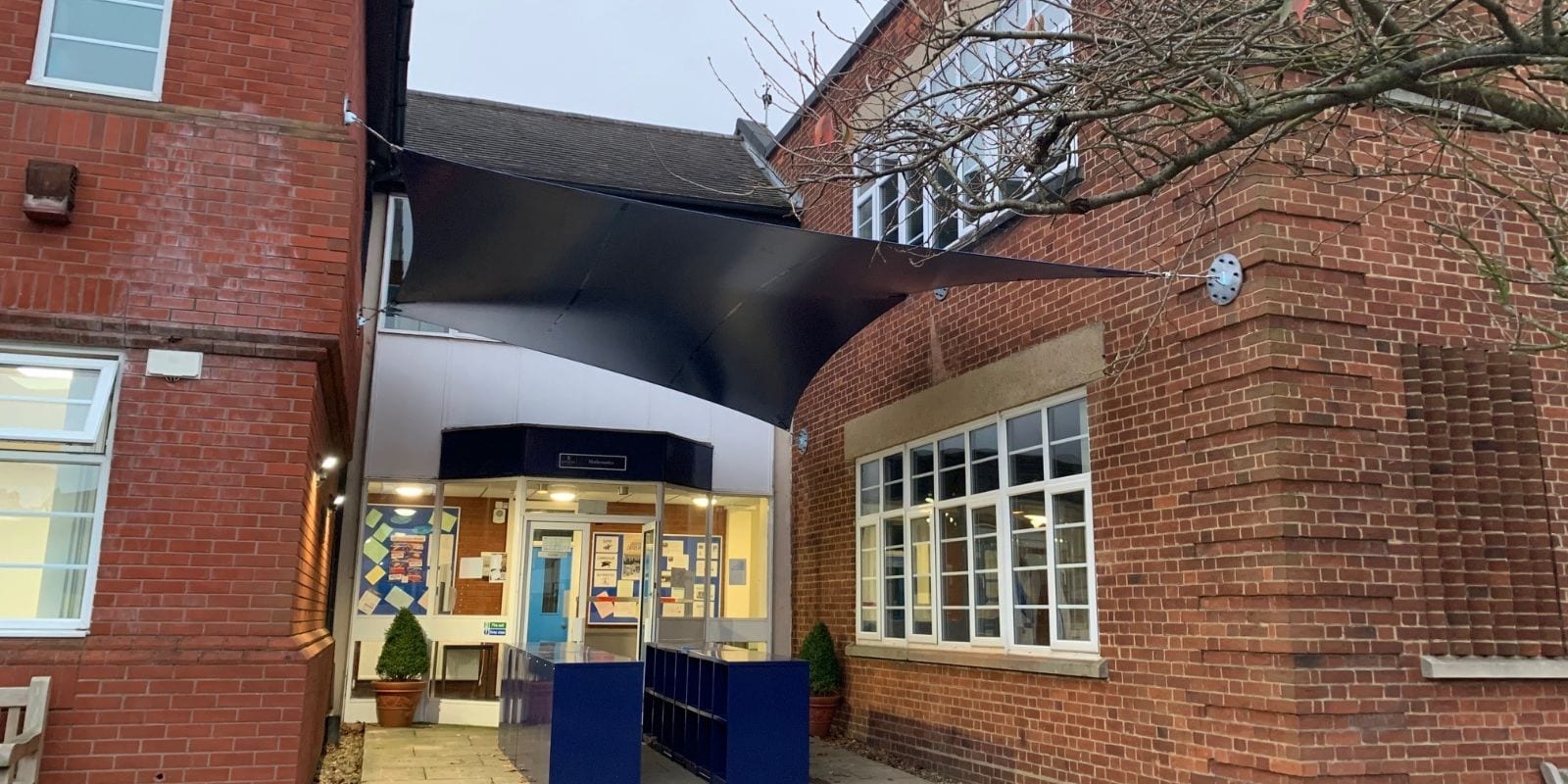 Wall-mounted shade sail we designed for Epsom College