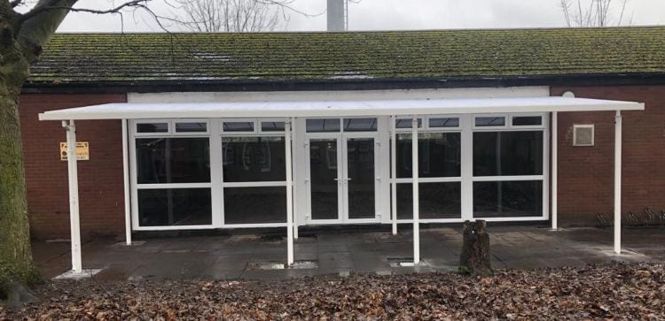 Straight roof shelter we installed for Mothers Against Violence