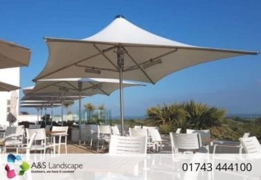White Fabric Parasols Covering Seating Area