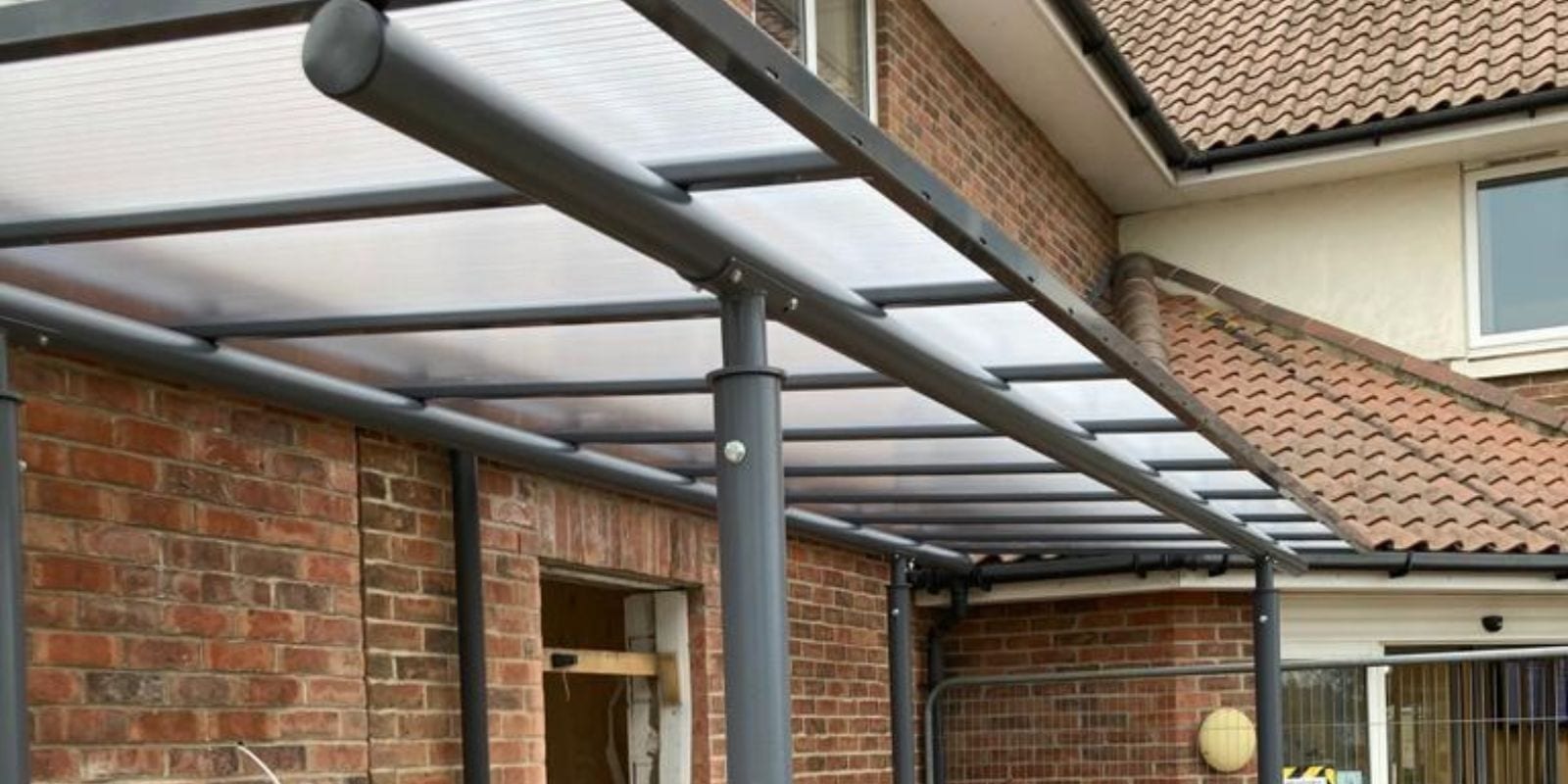 Straight roof shelter we installed at Hoveton & Wroxham Medical Centre