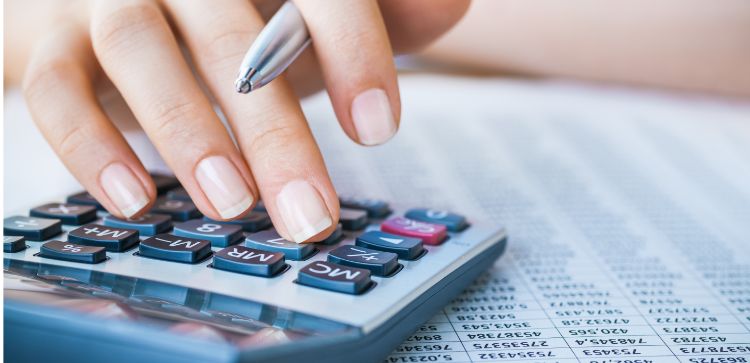 woman using calculator