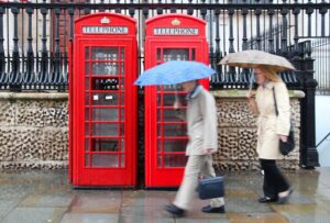 people walking in the rain in london people walking in the rain in london